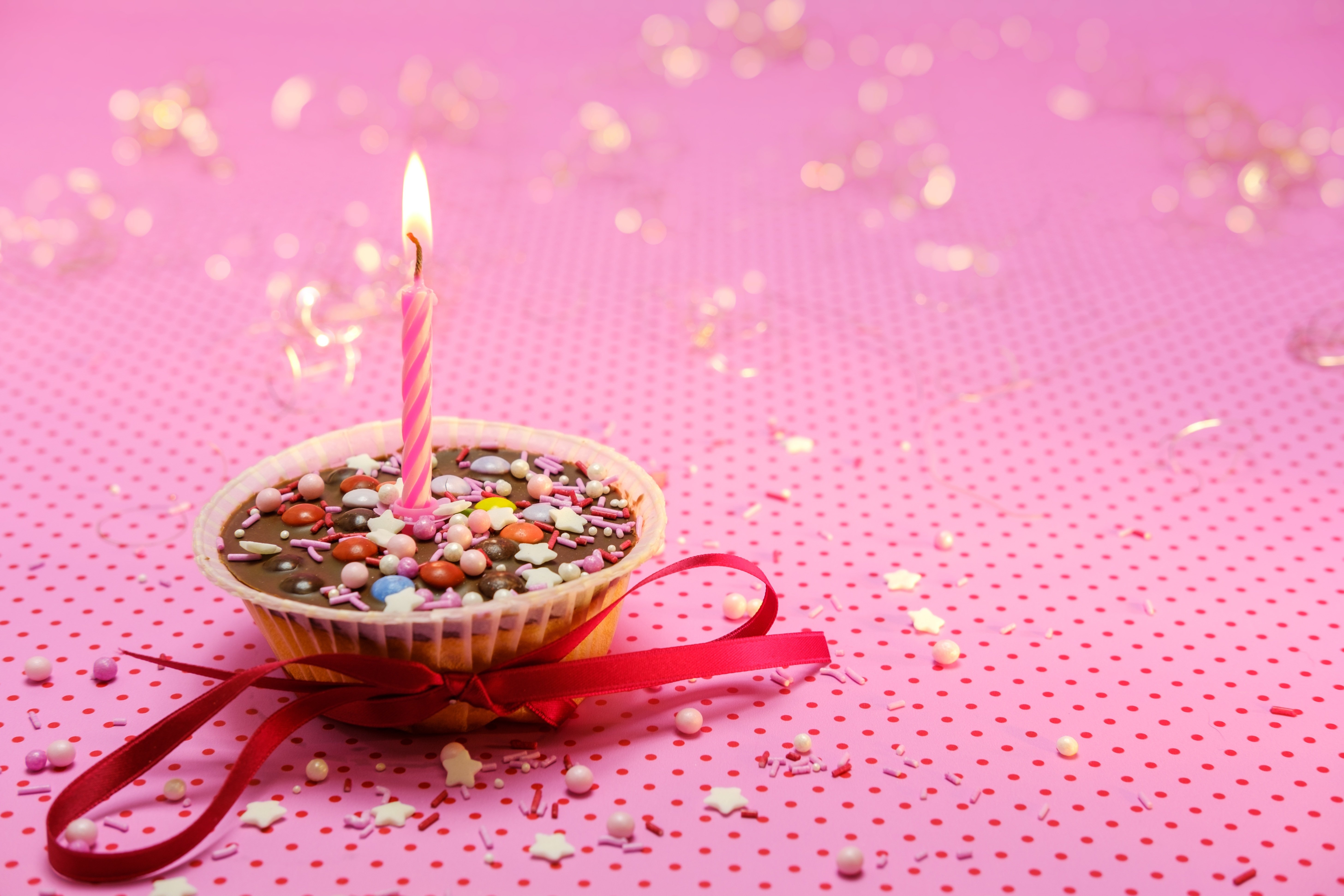 HD wallpaper, Birthday, Candle Light, 5K, Red Ribbon, Dessert, Cupcake, Pink Background, Muffin, Sugar Sprinkles, Aesthetic