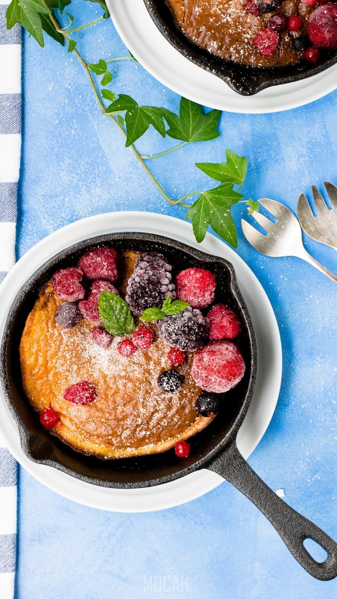 HD wallpaper, 1080X1920, Google Pixel 2 Wallpaper Hd Download, Pancakes In Cast Iron Skillet With Berries And Blue Cloth, Dutch Baby Pancake