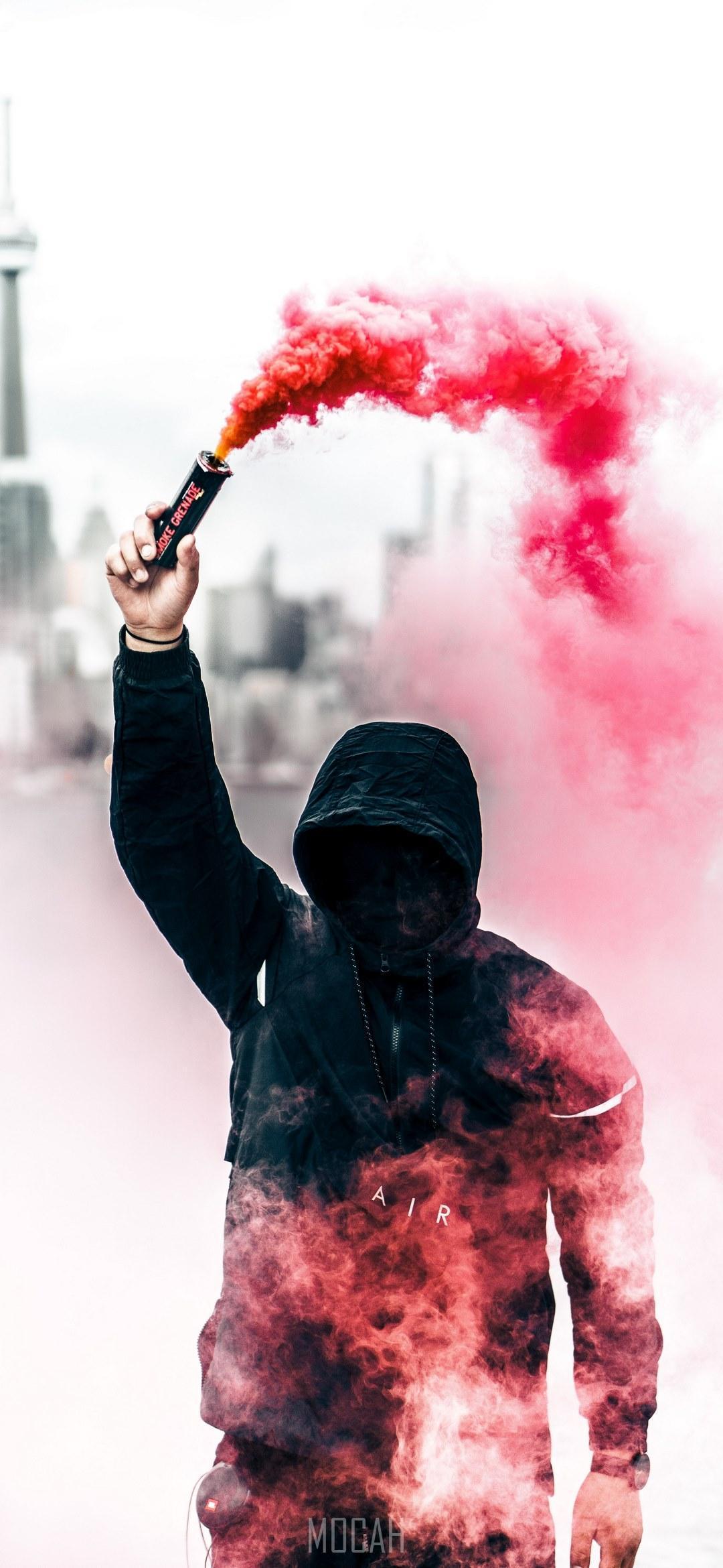 HD wallpaper, A Person In A Black Hoodie With Obscured Face Holds Up A Pink Smoke Grenade, Person With Pink Smoke Grenade, Google Pixel 4A 5G Screensaver, 1080X2340