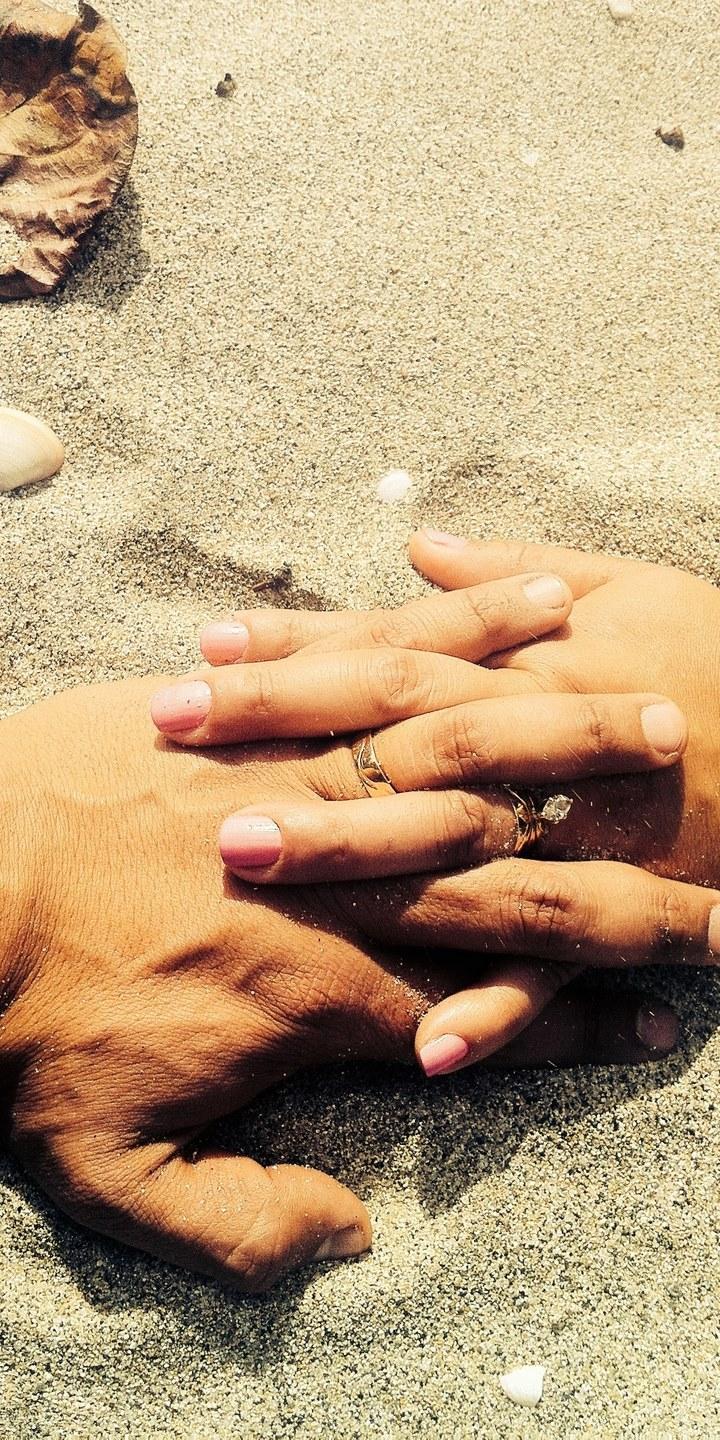HD wallpaper, Lovers Hands On Sand, A Married Couple At The Beach Wearing Wedding Rings Holds Hands On The Sand, 720X1440, Xiaomi Redmi 6 Wallpaper Download