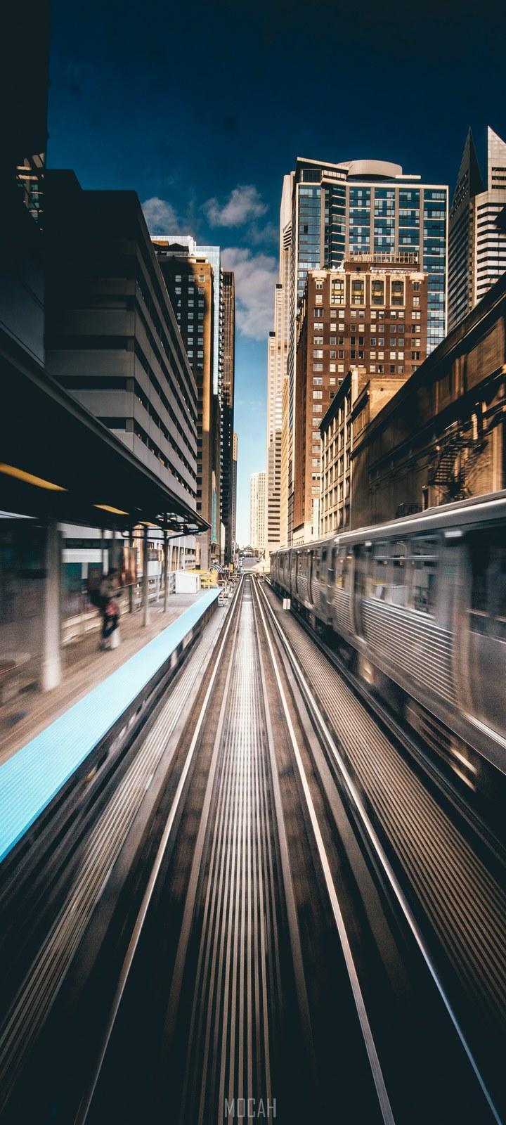 HD wallpaper, A Blurred Image Showing Trains Moving On An Outdoor Railway In Chicago, Samsung Galaxy A21S Wallpaper Download, Train Station Action In Chicago, 720X1600