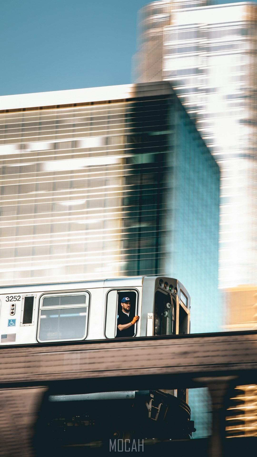 HD wallpaper, A Man Looking Out Of A Moving Urban Trail In Chicago, 1080X1920, Man In A Moving Urban Train, Htc One X10 Full Hd Wallpaper